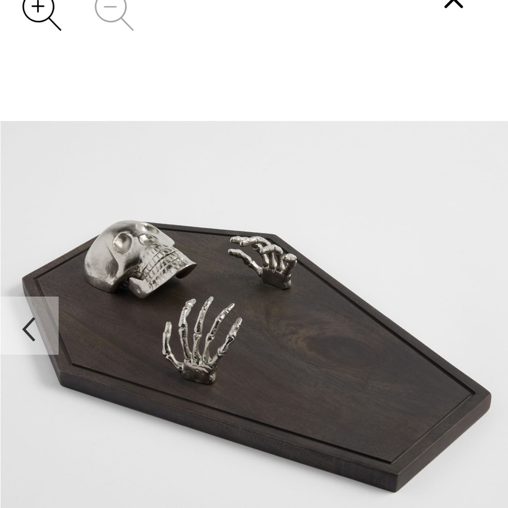 Skeleton on Dark Brown Coffin charcuterie board by Pottery Barn